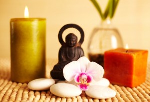 Spa still life buddha statue and candles, orchid flower